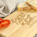 Close-up of laser engraved detail on natural wood cheese board