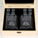 Wooden whiskey gift box open to reveal personalised glasses and reusable whiskey stones for corporate gifting.