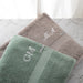 High quality cotton bath sheet in classic sage or mocha, customised with embroidered name or initials, ideal for gifting or home spa days.