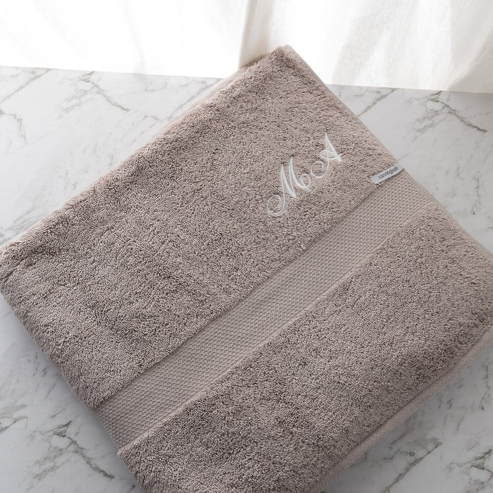 Personalised cotton bath sheet in mocha, folded neatly with embroidered name for a luxurious and stylish touch.