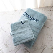 Personalised light blue towel set with embroidered name and initial, perfect gift for newborns, birthdays or special occasions
