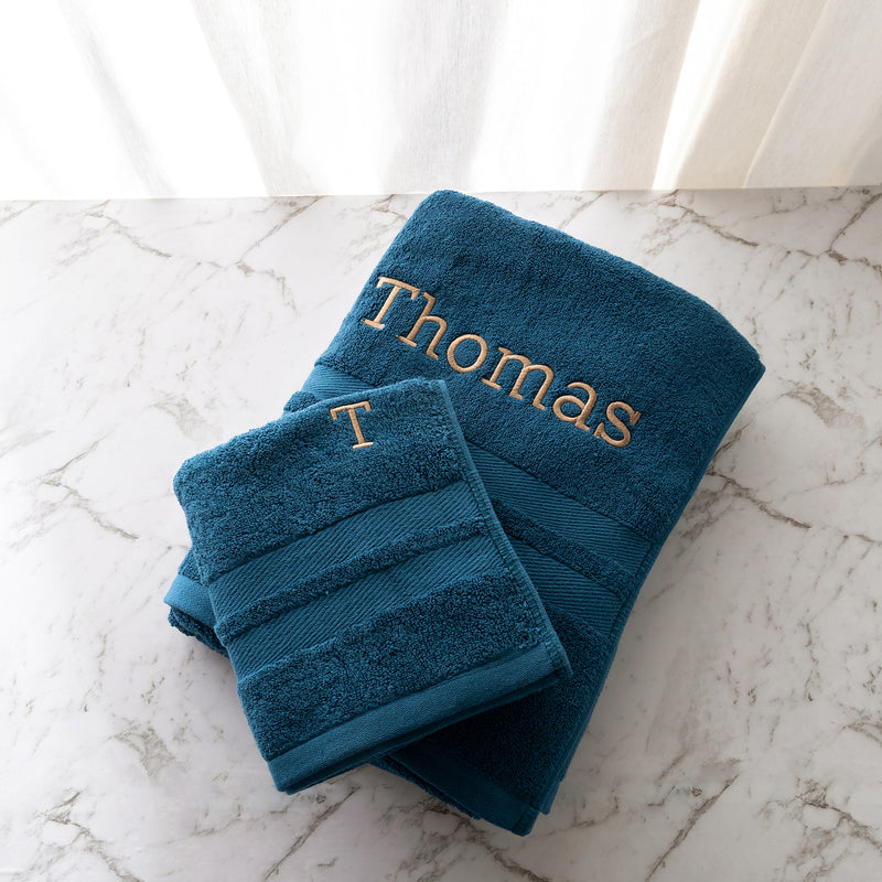 Personalised navy towel set with embroidered name and initial, perfect gift for newborns, birthdays or Christmas