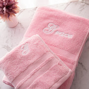 Custom pink cotton bath and hand towel set with choice of font and thread colour, ideal personalised gift for girls