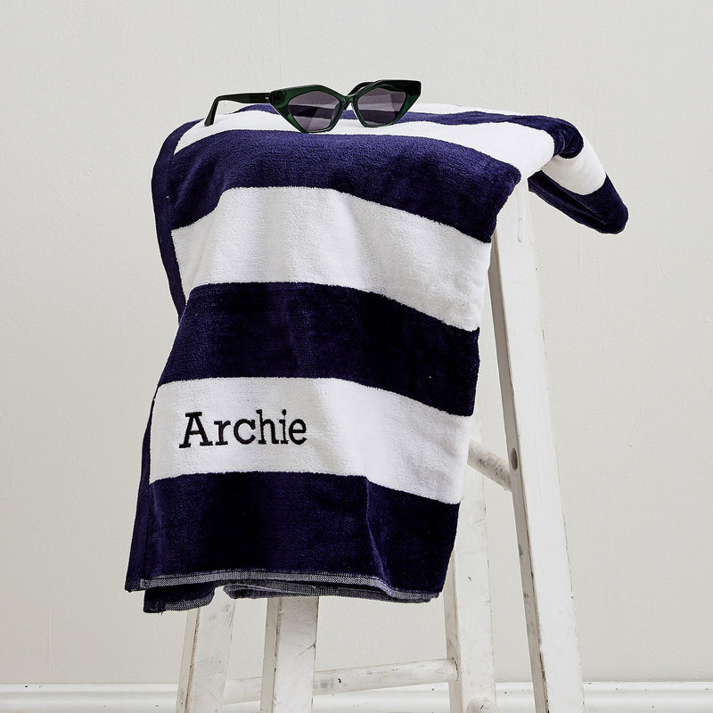 Navy striped beach towel for children, embroidered with name in black thread