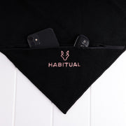 Black microfibre gym towel with embroidered logo and zip pocket