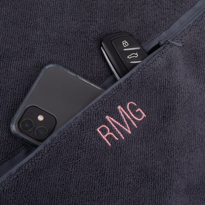 Charcoal gym towel with custom initials embroidery and storage pocket