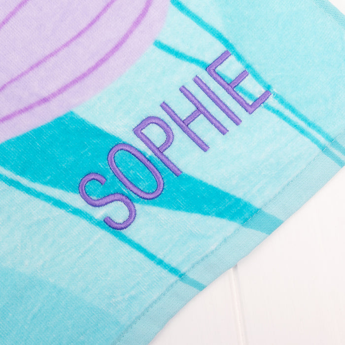 Poncho style hooded towel with side button, perfect for beach or pool