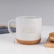 Rustic stoneware-look 360ml ceramic mug professionally laser engraved with a custom logo, presented as a thoughtful employee milestone, retirement or farewell gift.