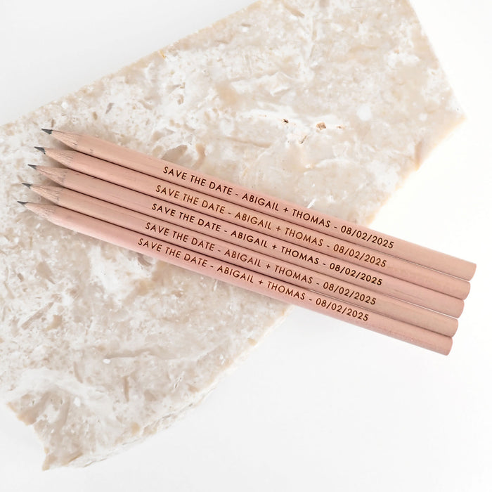 Custom Designed engraved wooden save the date pencils.