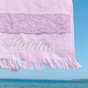 Lilac cotton hooded beach towel for kids, personalised with their name, perfect for swimming lessons, beach days and poolside fun.