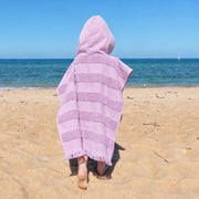 Personalised kids beach towel poncho in lilac with cosy hood and absorbent cotton terry, a practical Christmas gift for children.