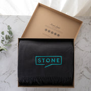 Embroidered merino wool blanket with custom company logo in gift box