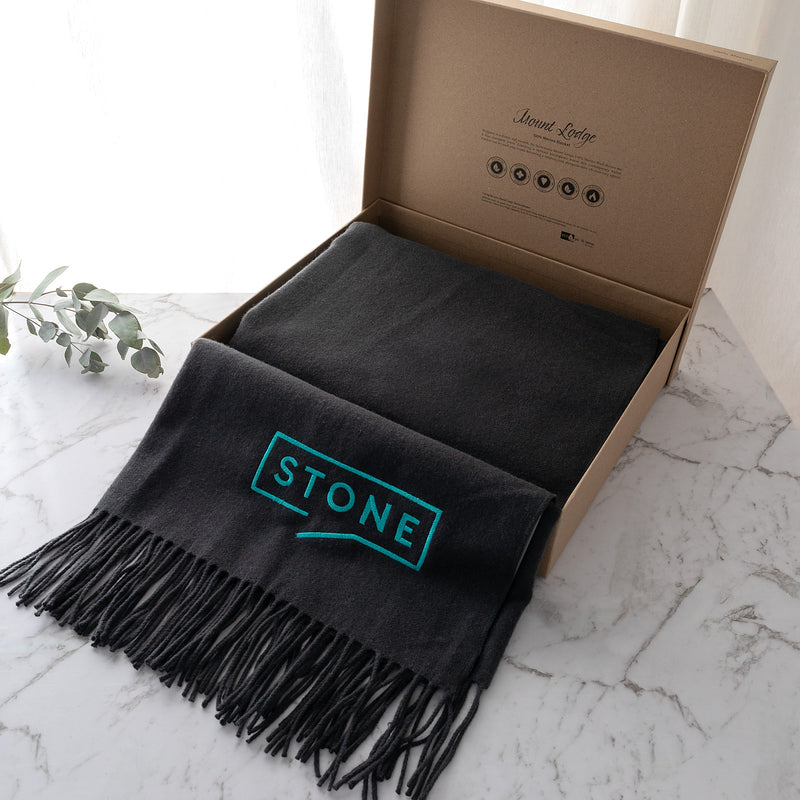 Corporate gift set featuring personalised blanket and elegant packaging