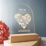 Personalised sympathy night light with clear acrylic sign and wooden LED base, softly glowing in memory of a loved one.