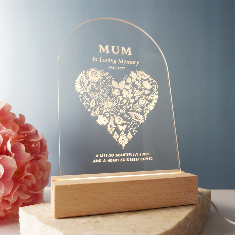 Personalised sympathy night light with clear acrylic sign and wooden LED base, softly glowing in memory of a loved one.
