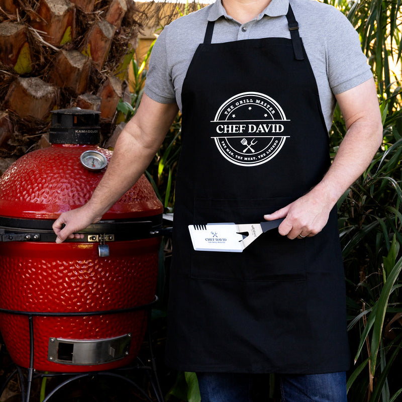 Personalised BBQ gift hamper featuring an engraved stainless steel BBQ tool and matching custom apron for Dad, Grandad or any grill master.