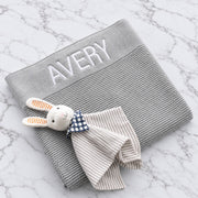 Personalised grey knitted baby blanket embroidered with name
