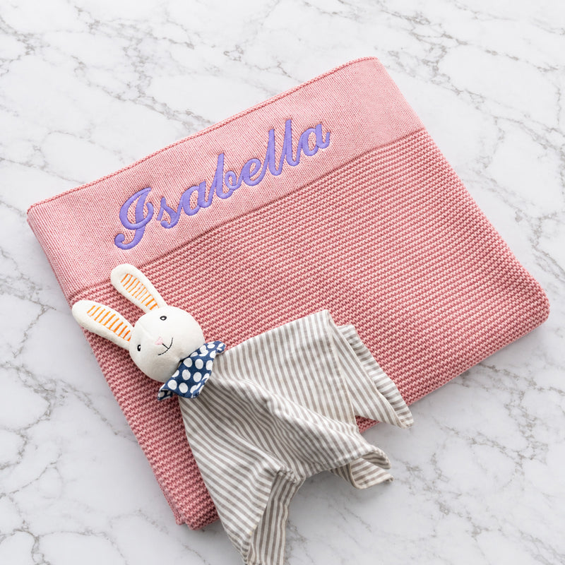 Personalised pink knitted baby blanket embroidered with child’s name