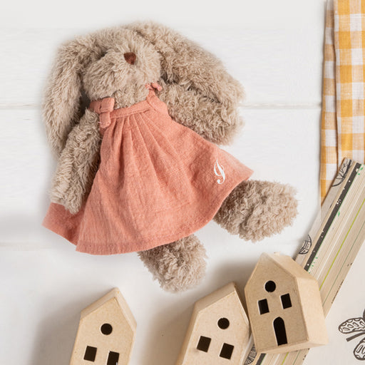 Personalised taupe bunny rabbit wearing a dusty pink embroidered dress with a child’s name, perfect for Easter, birthdays, or newborn gifts.