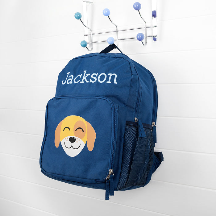 Personalised navy kids backpack with embroidered child's name and smiling puppy face print.
