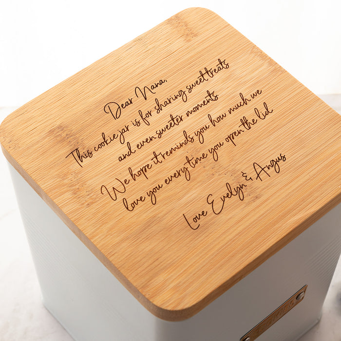 Custom engraved cookie tin in vintage ribbed design with airtight bamboo lid, ideal as a unique gift.