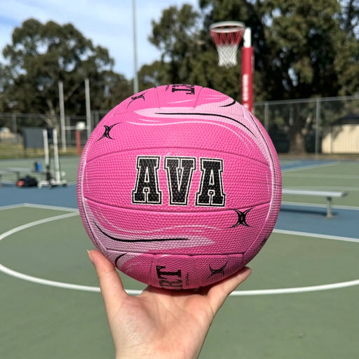 Pink Gilbert netball personalised with first name or surname in black