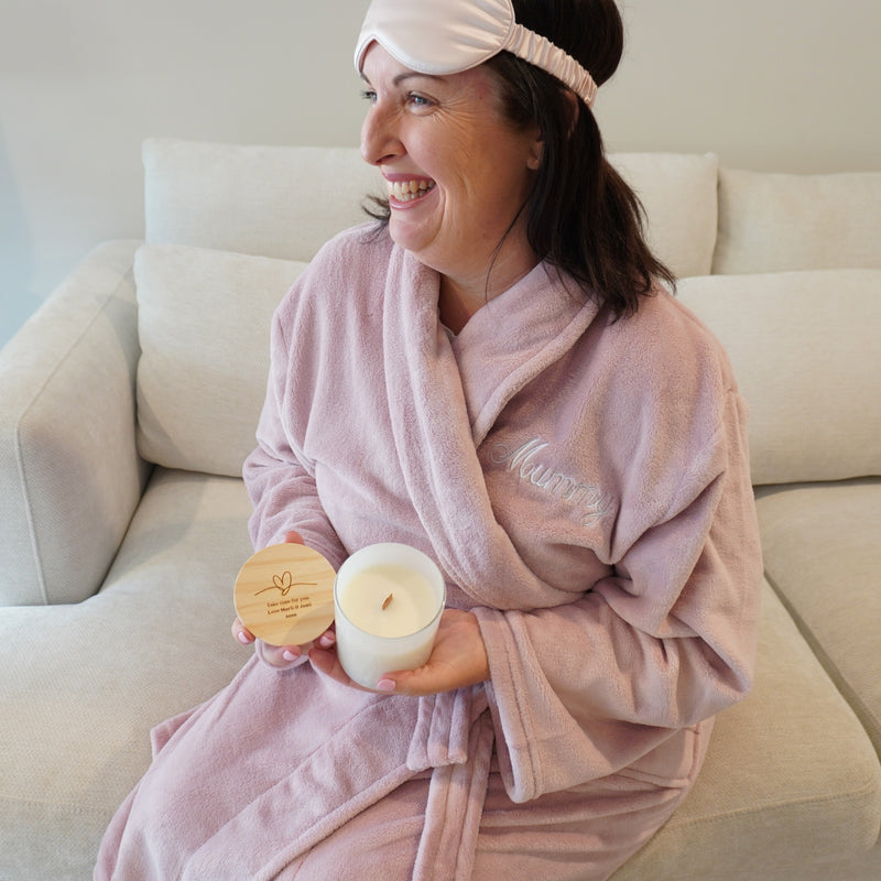 Blush pink silk eye mask with engraved lid soy candle and robe