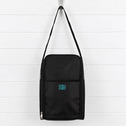 Personalised shoe bag embroidered with a name or initials, featuring breathable mesh sides, zip opening and adjustable shoulder strap.