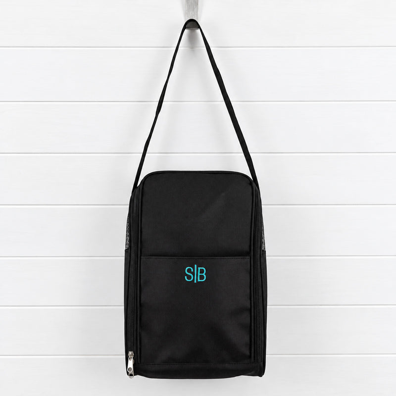 Personalised shoe bag embroidered with a name or initials, featuring breathable mesh sides, zip opening and adjustable shoulder strap.