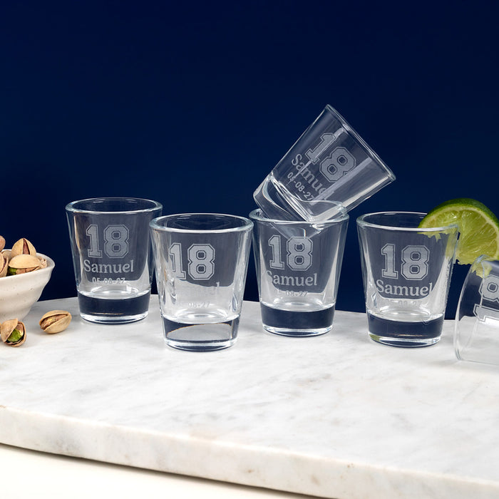 Personalised 50ml shot glass engraved with 18th birthday design, name, and date.