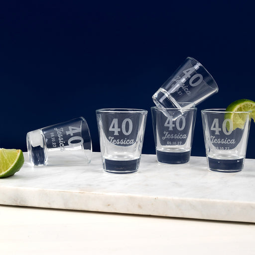 Personalised 50ml shot glass engraved with 40th birthday design, name, and date.