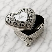 Engraved silver heart jewellery box for storing rings, earrings and small keepsakes, personalised with their name.