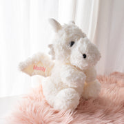 Custom newborn gift plush dragon featuring name and birth date on wings, made from ultra-soft fabric for snuggles