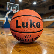 Personalised Spalding TF-50 basketball with custom name printed in black