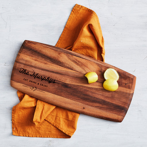 Personalised walnut wood Christmas tapas board with engraved festive message and family name