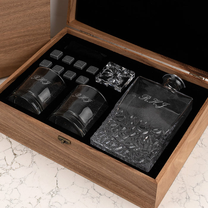 Custom monogram whiskey set with glasses, stones, and decanter in wooden case.