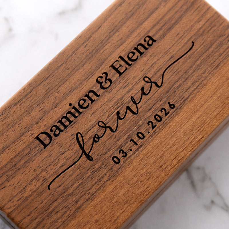 Professionally laser engraved walnut ring box with velvet lining.