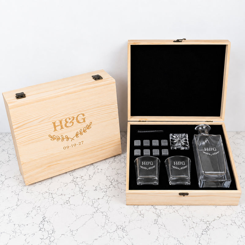 Personalised anniversary whiskey decanter gift set with 870ml decanter, two engraved scotch glasses and whiskey stones in a wooden gift box.