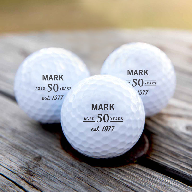 Personalised golf balls in a black gift box, custom printed with initials – perfect birthday gift for a golf lover.