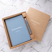 Personalised light blue notebook and pen gift set with white UV printed name in a premium kraft gift box