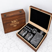 Personalised whiskey gift set with 870ml decanter, two engraved whiskey glasses and reusable whiskey stones presented in a rustic wooden gift box.