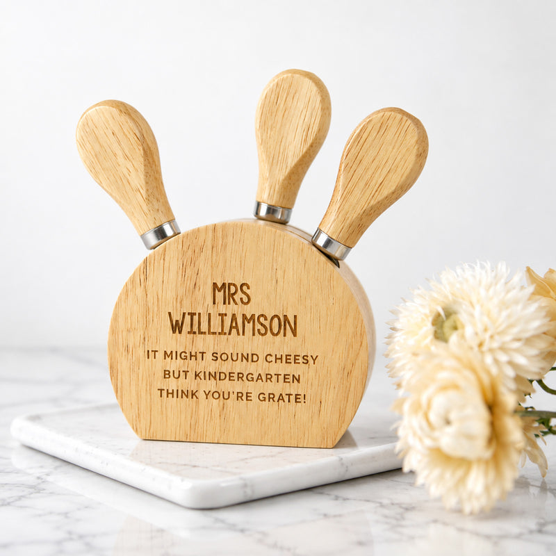 Personalised wooden cheese knife set engraved as a thoughtful teacher thank you gift.
