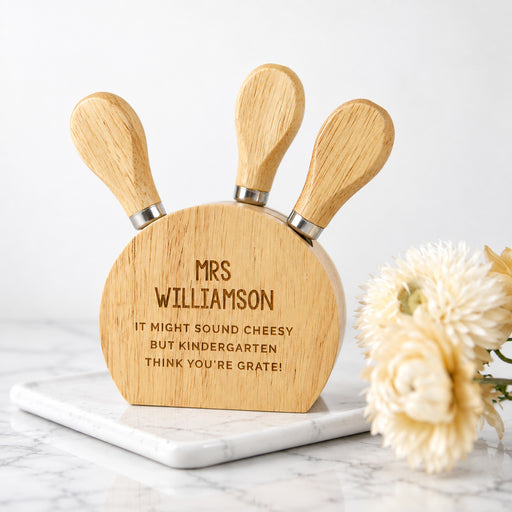 Personalised wooden cheese knife set engraved as a thoughtful teacher thank you gift.