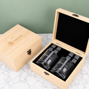 Personalised corporate whiskey gift set with two engraved whiskey glasses, eight reusable whiskey stones and a branded wooden presentation box.