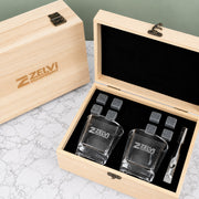 Personalised corporate whiskey gift set with two engraved square glasses, reusable whiskey stones, tongs and branded wooden presentation box.