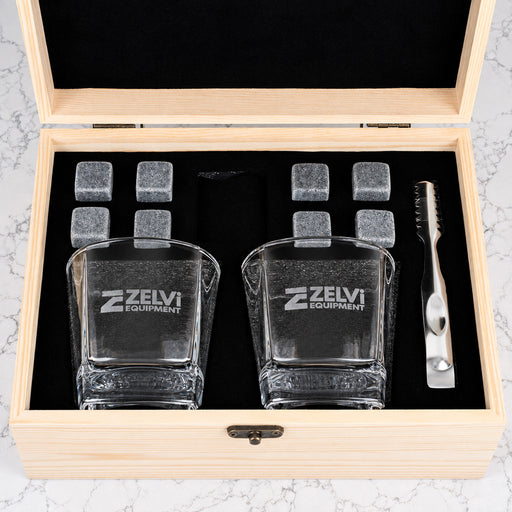 Premium corporate whiskey set with personalised glasses, whiskey stones and company logo engraved on a wooden gift box for clients and executives.