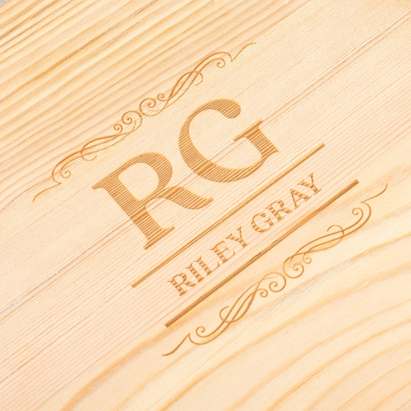 Personalised whiskey glass gift set presented in a wooden box with custom engraving and reusable whiskey stones for whiskey lovers.