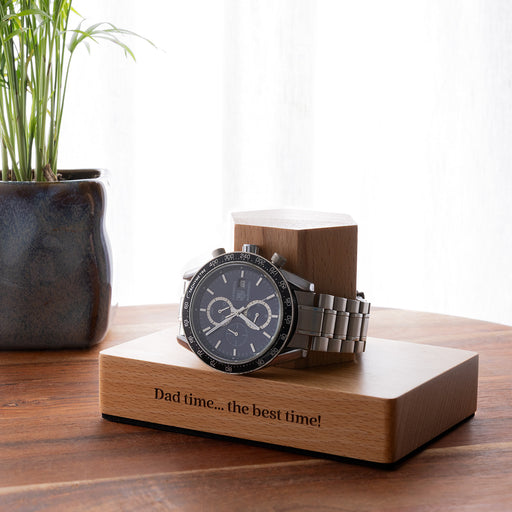 Custom wooden watch holder with engraved base, perfect for organising a favourite watch on a bedside table or dresser.
