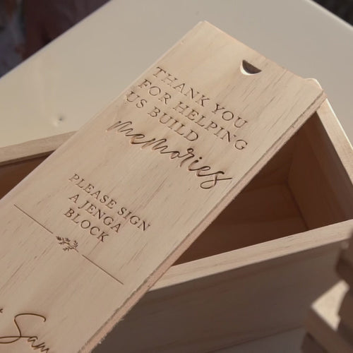 Wooden tumbling tower game with engraved box