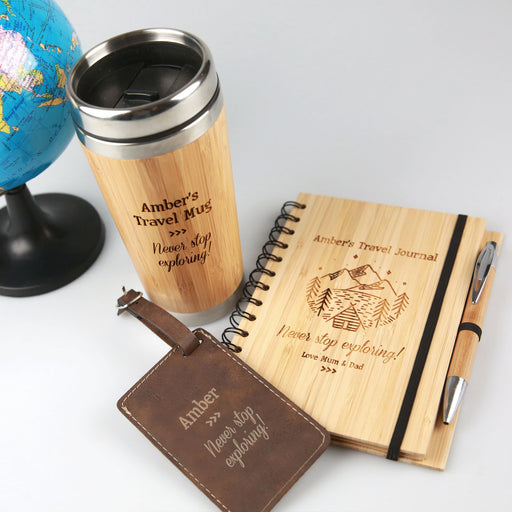 Custom Designed Travel Hamper include engraved travel mug, travel journal and leather luggage tag.